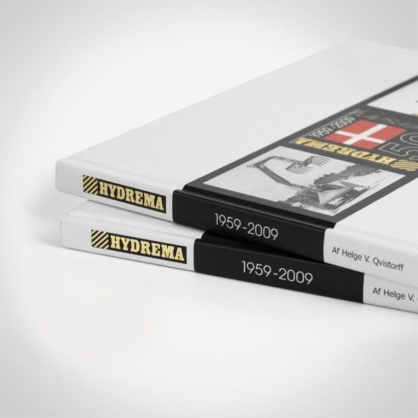 Hydrema 50 anniversary book pile - back