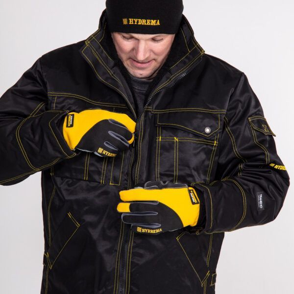 Man wearing hydrema winter hjacket, hat and gloves